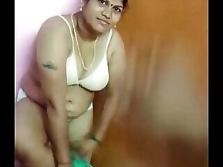 Indian housewife sheds clothes while brushing her hair and undressing